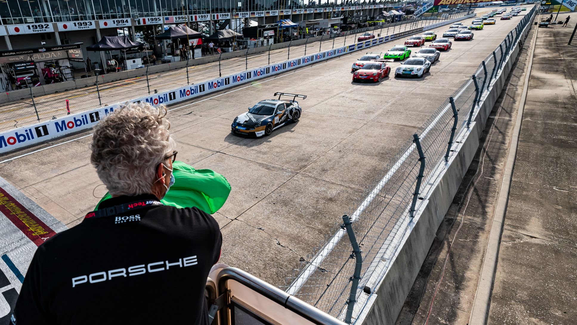 Porsche Carrera Cup North America - Sebring - Race 1 - Dr. Daniel Armbruster Waves the Green Flag to Start the Race 1, 2021, PCNA